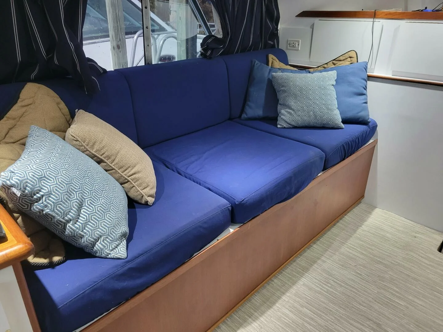 Blue seating inside the Just Cuz cabin