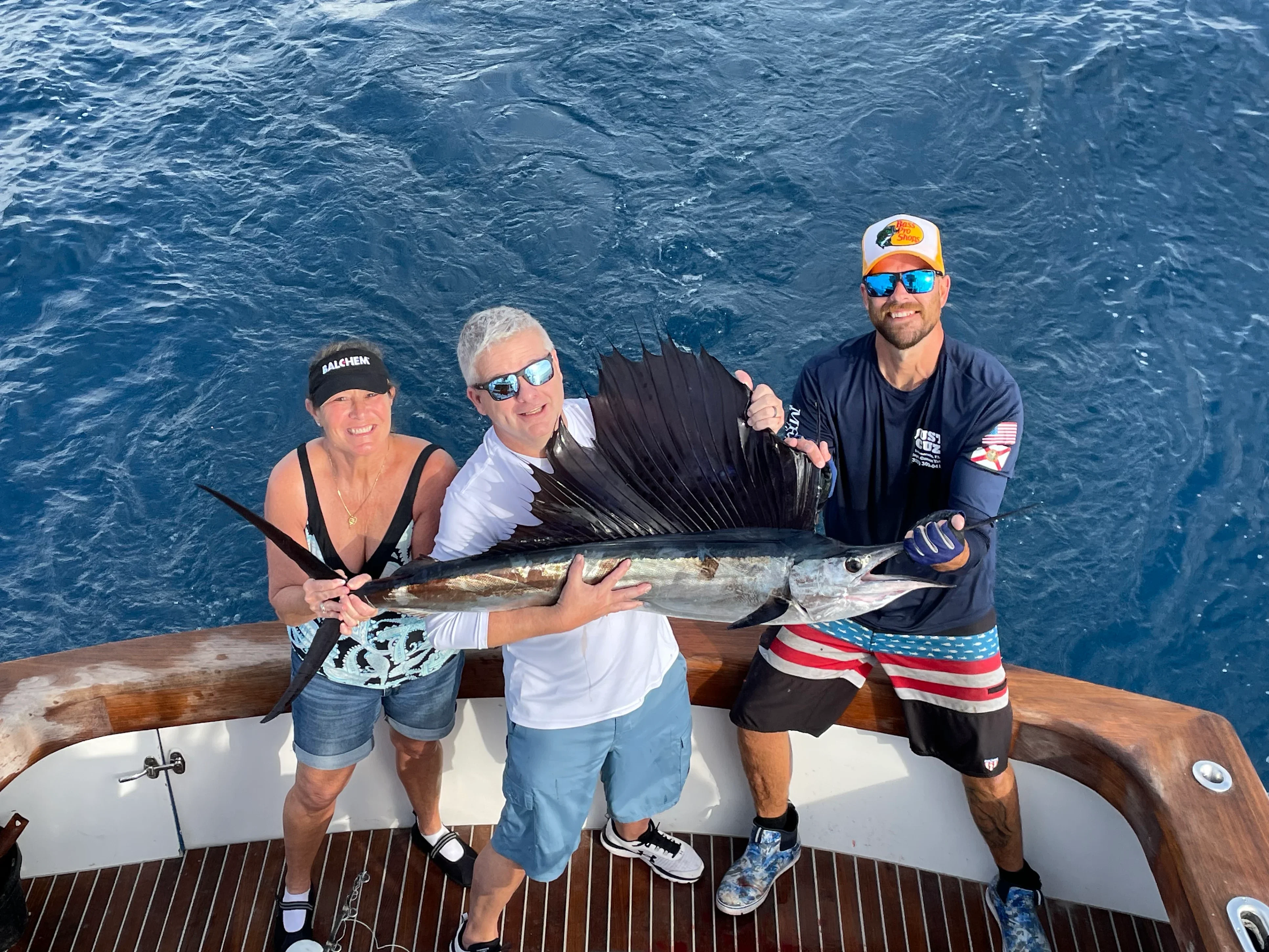 Anglers with a sailfish alongside Just Cuz